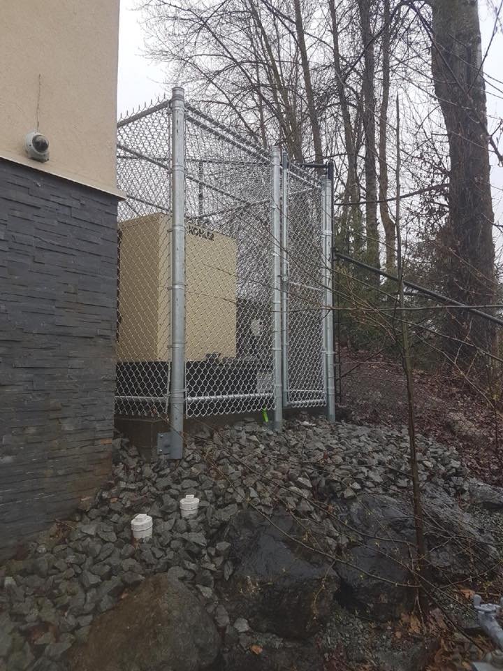 Commercial chain link security enclosure — Fraser Valley, BC 8-foot galvanized chain link commercial security enclosure with covered top installed in the Fraser Valley
