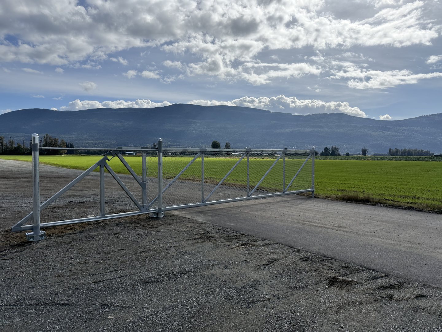 Cantilever gate beside an agricultural field — photograph supplied by LS Fencing & Metal Work