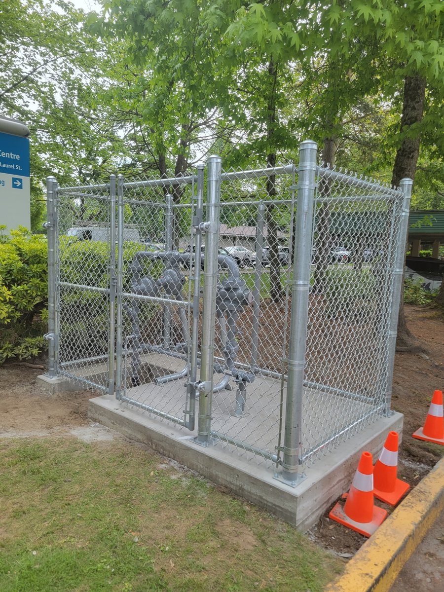 Chain-link equipment enclosure on a concrete base — photograph supplied by LS Fencing & Metal Work